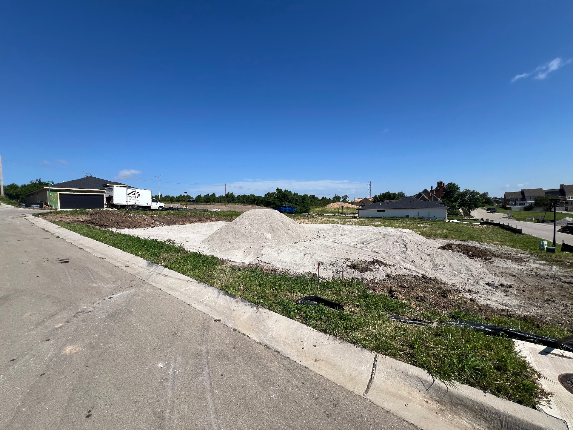 Kansas City new construction site prepared for grading, drainage, and commercial landscaping work by Juke KC