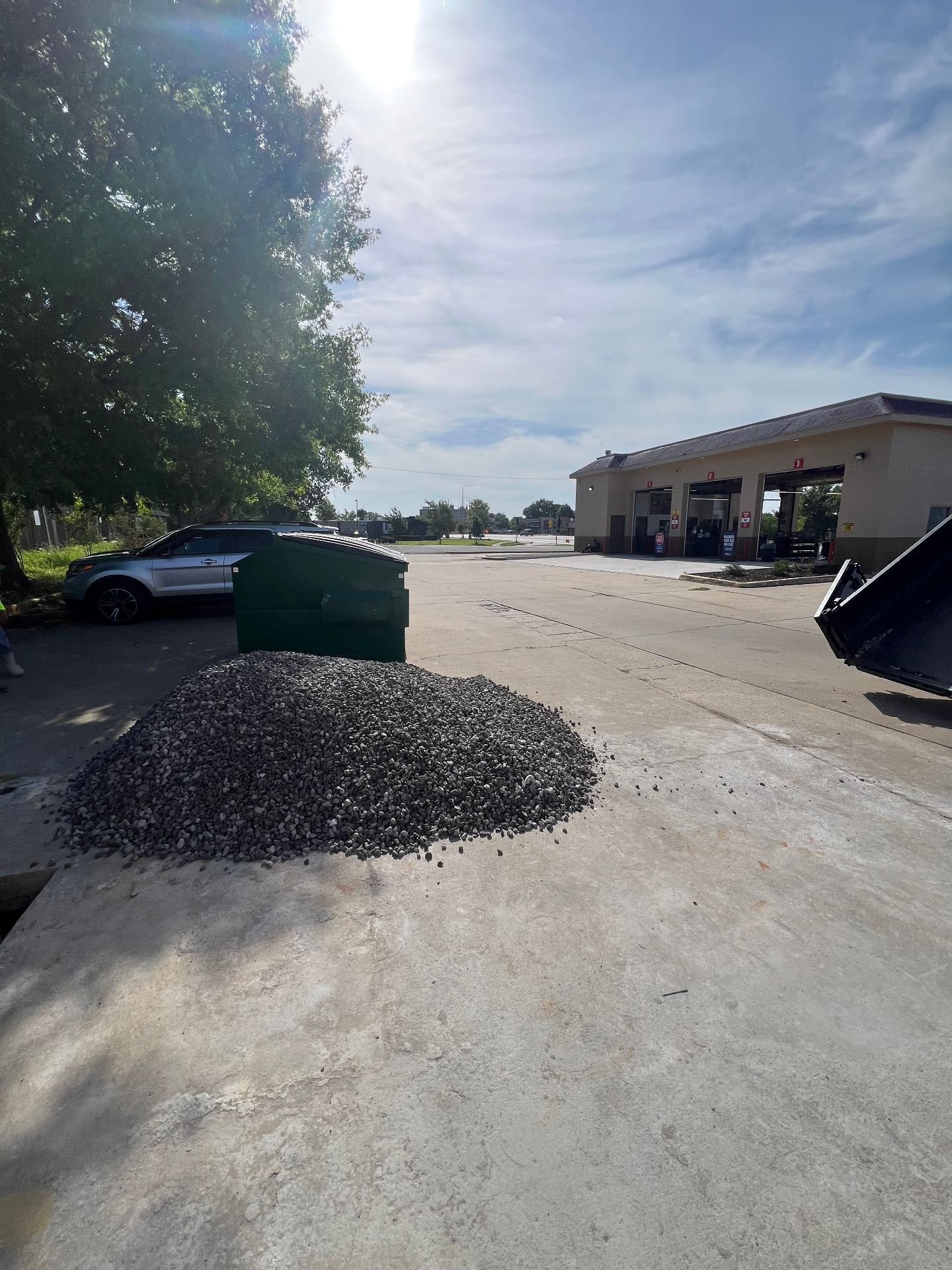 Gravel material staged on a Kansas City commercial site prepped for landscape and hardscape installation