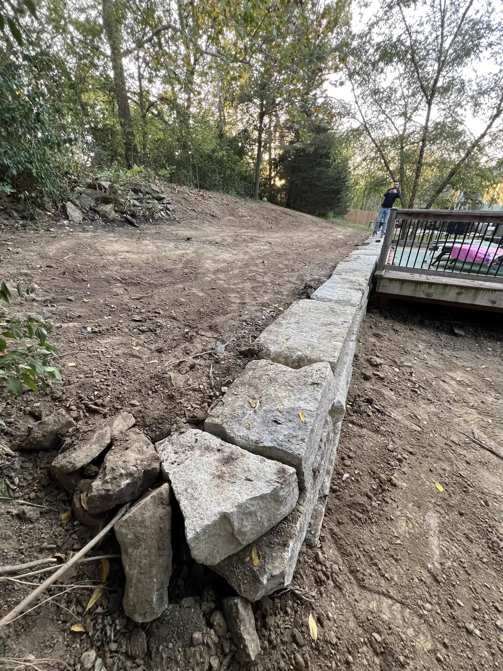 Limestone Wall Rebuild with Drainage & Grading