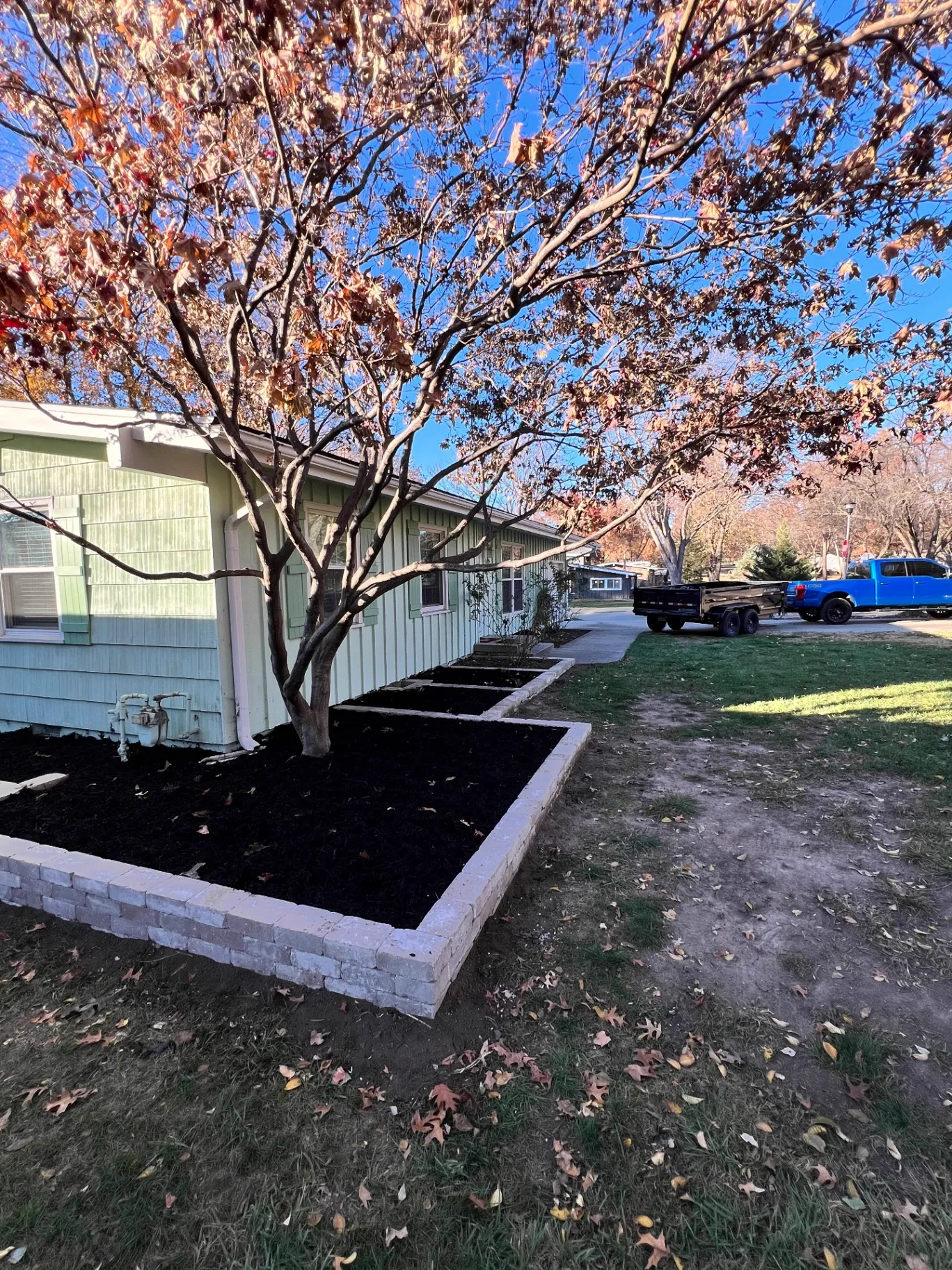 Raised Bed Retaining Walls with Soil and mulch installation