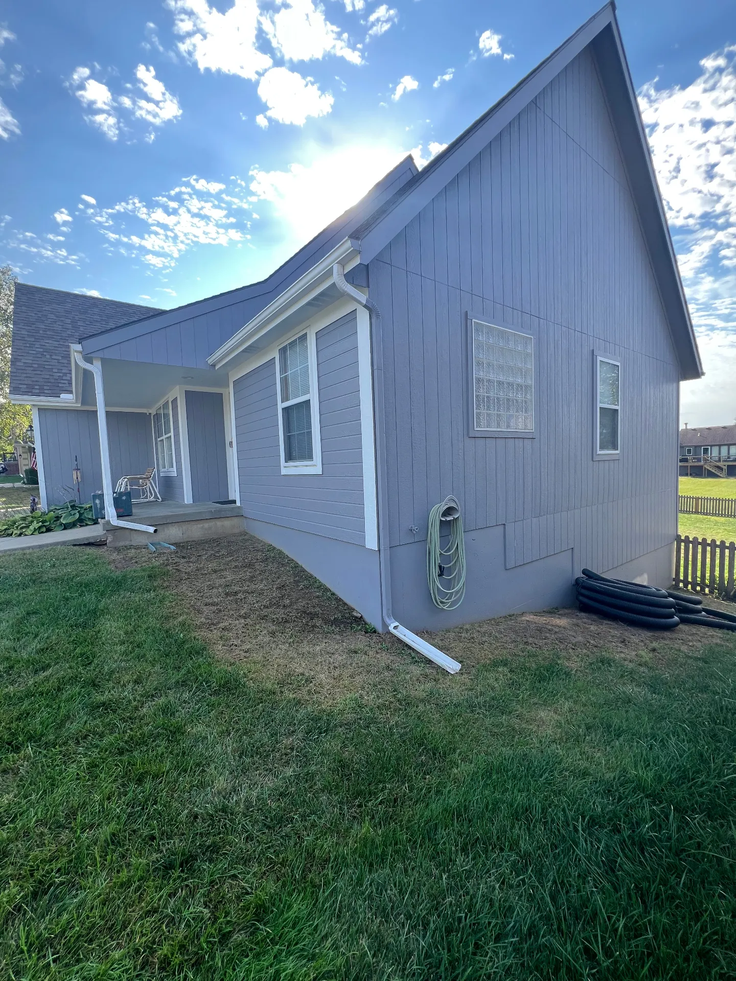 Before retaining wall installation - side yard with gutter